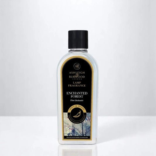 A bottle of Ashleigh & Burwood Enchanted Forest Lamp Fragrance on a white background