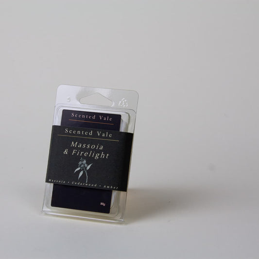 Scented Vale 'Massoia & Firelight' wax melts in a clear plastic clamshell package with a Dark label, photographed on a plain light grey background.